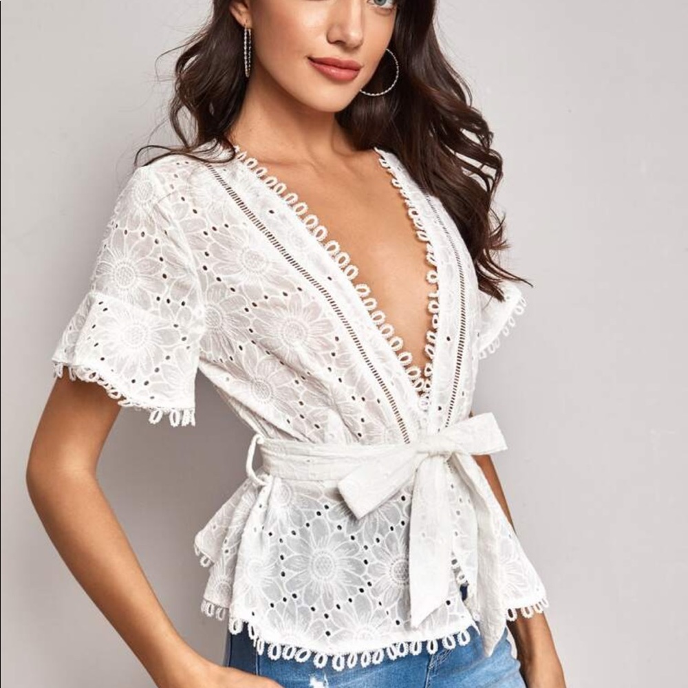 Eyelet embroidered wrap belted blouse